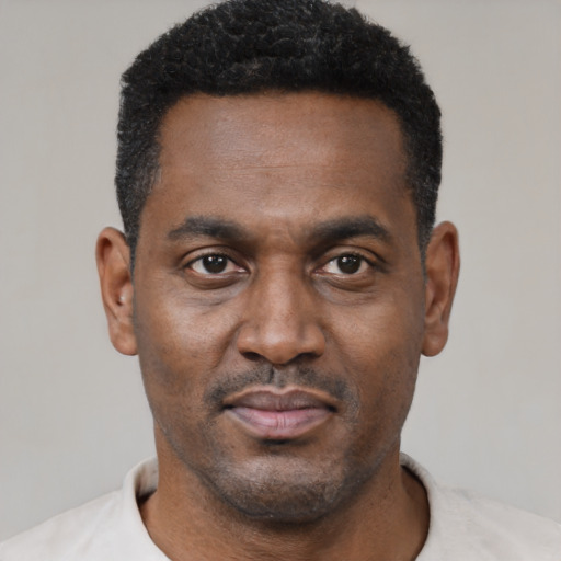 Neutral black young-adult male with short  black hair and brown eyes
