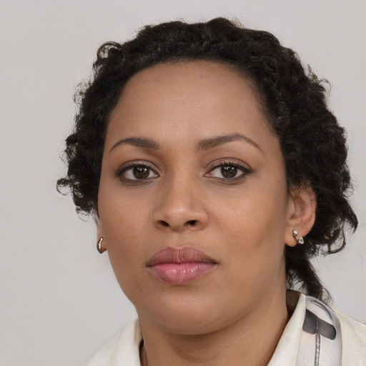 Neutral black young-adult female with long  brown hair and brown eyes