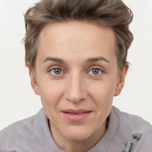 Joyful white adult female with short  brown hair and brown eyes