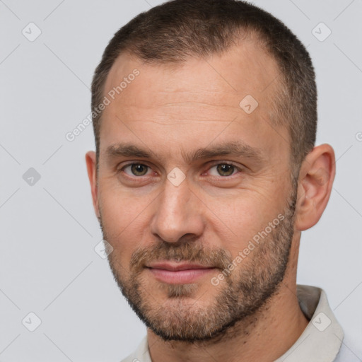 Joyful white adult male with short  brown hair and brown eyes