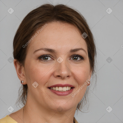 Joyful white adult female with medium  brown hair and grey eyes