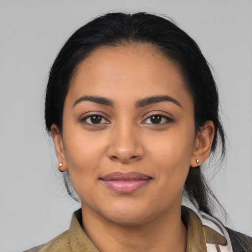 Joyful latino young-adult female with medium  black hair and brown eyes