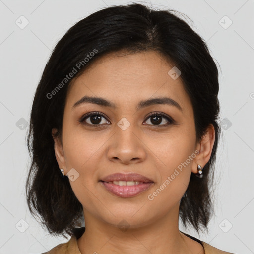 Joyful latino young-adult female with medium  brown hair and brown eyes