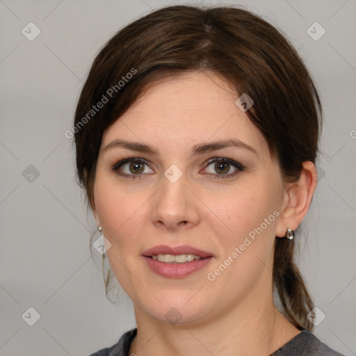 Joyful white young-adult female with medium  brown hair and green eyes