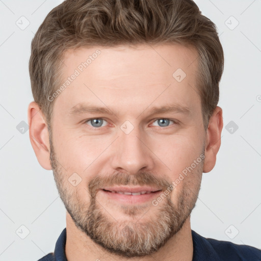 Joyful white adult male with short  brown hair and grey eyes