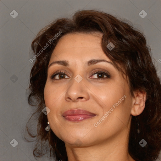 Joyful white adult female with long  brown hair and brown eyes