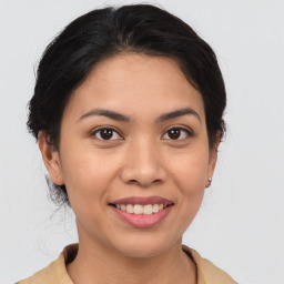 Joyful white young-adult female with medium  brown hair and brown eyes