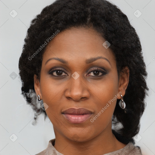 Joyful black adult female with medium  black hair and brown eyes