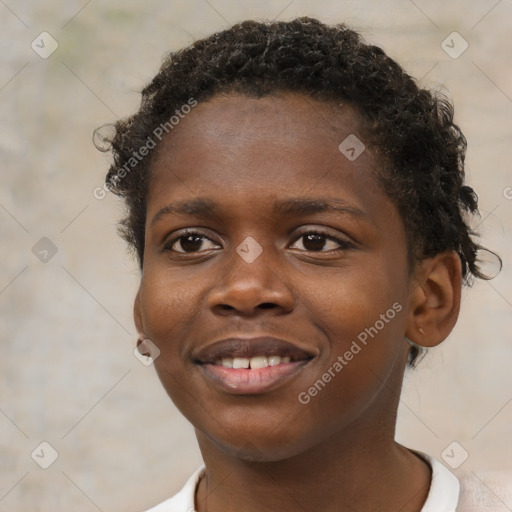 Joyful black young-adult male with short  brown hair and brown eyes