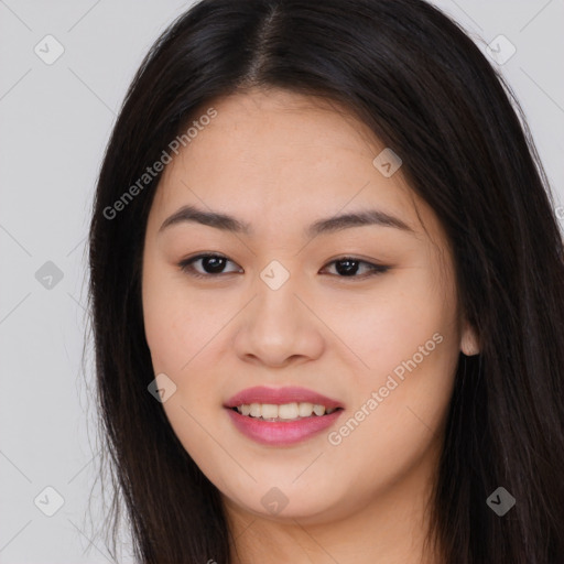 Joyful asian young-adult female with long  brown hair and brown eyes