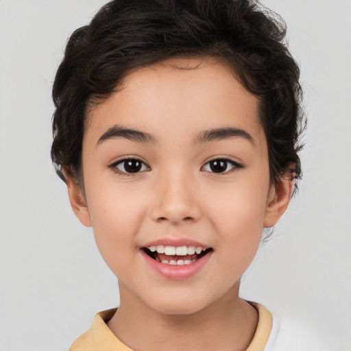 Joyful white child female with short  brown hair and brown eyes