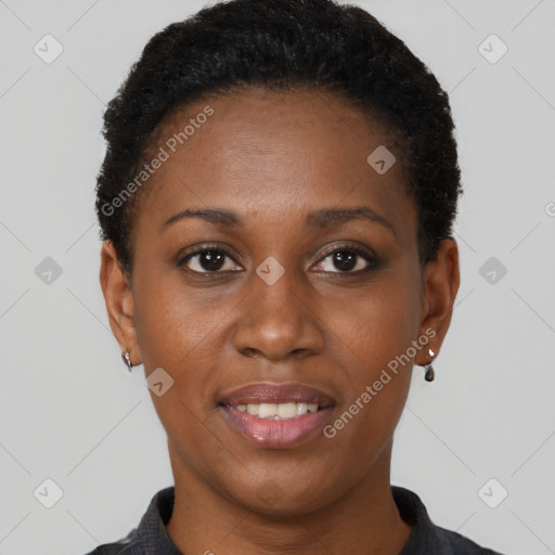 Joyful black young-adult female with short  black hair and brown eyes