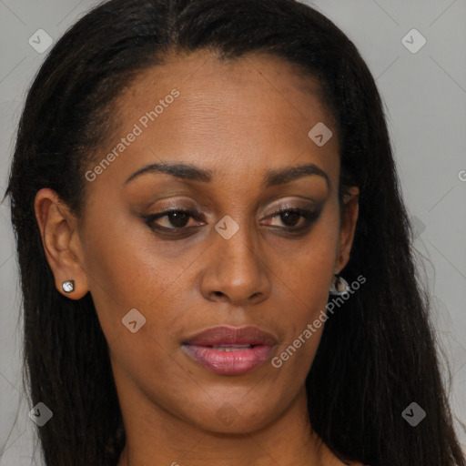 Joyful black young-adult female with long  brown hair and brown eyes