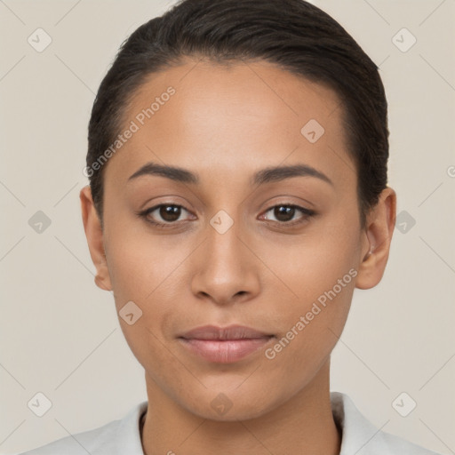 Joyful latino young-adult female with short  brown hair and brown eyes