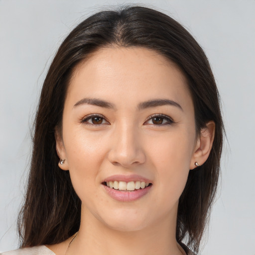 Joyful white young-adult female with medium  brown hair and brown eyes
