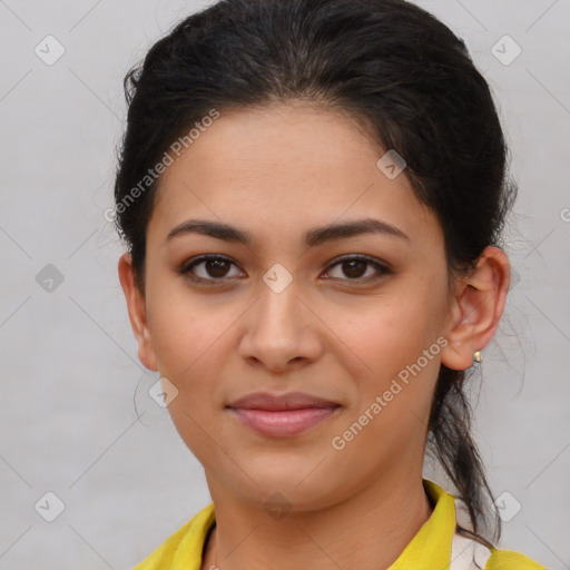 Joyful latino young-adult female with medium  brown hair and brown eyes