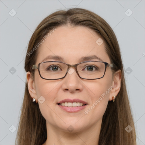 Joyful white adult female with long  brown hair and grey eyes