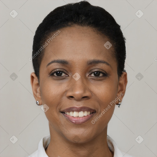 Joyful black young-adult female with short  black hair and brown eyes