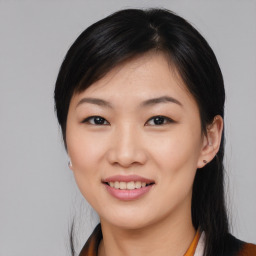 Joyful asian young-adult female with short  black hair and brown eyes