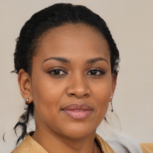 Joyful black young-adult female with medium  brown hair and brown eyes