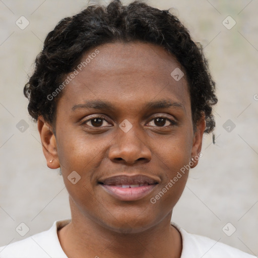 Joyful black young-adult male with short  brown hair and brown eyes