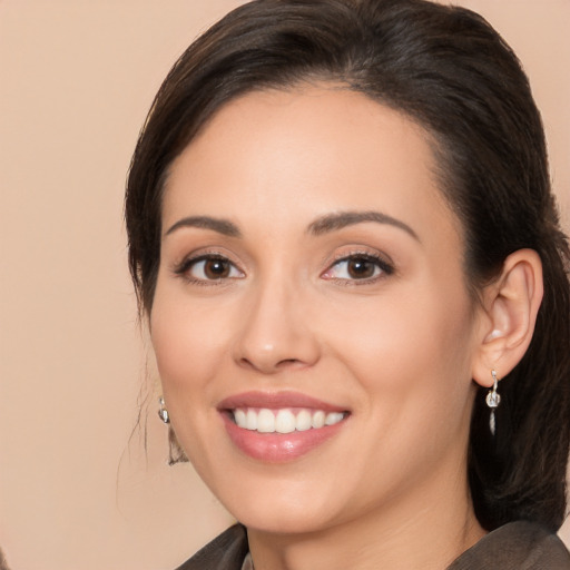 Joyful white young-adult female with medium  brown hair and brown eyes