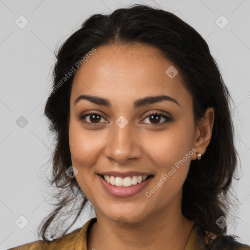 Joyful latino young-adult female with medium  brown hair and brown eyes