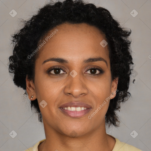 Joyful black young-adult female with short  brown hair and brown eyes