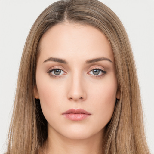 Neutral white young-adult female with long  brown hair and brown eyes