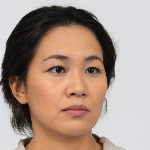 Neutral asian young-adult female with medium  brown hair and brown eyes