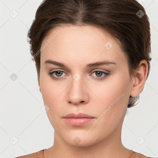 Neutral white young-adult female with short  brown hair and brown eyes