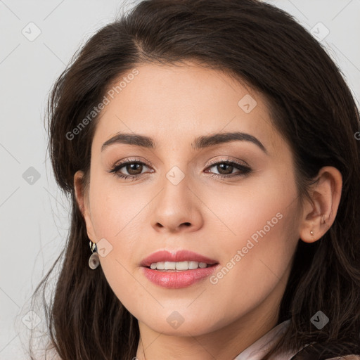 Joyful white young-adult female with long  brown hair and brown eyes