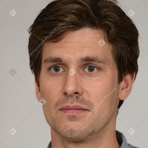 Joyful white adult male with short  brown hair and grey eyes