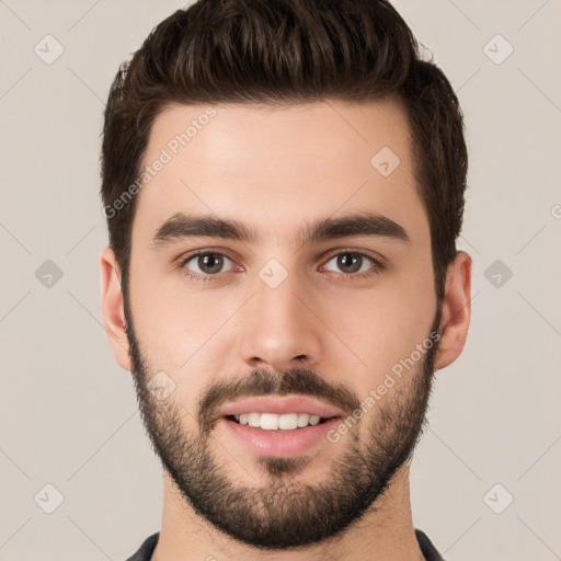 Joyful white young-adult male with short  brown hair and brown eyes