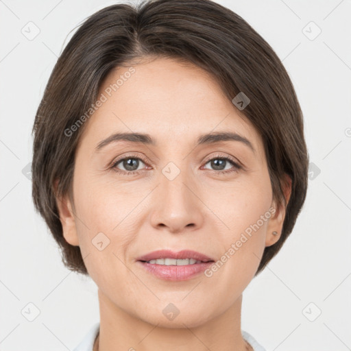 Joyful white adult female with short  brown hair and grey eyes