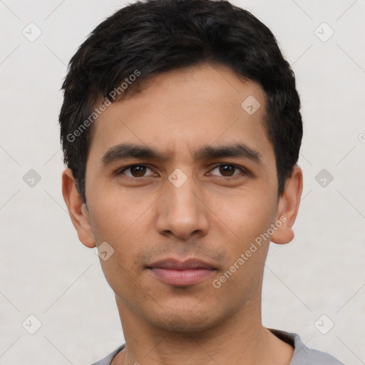 Neutral latino young-adult male with short  black hair and brown eyes