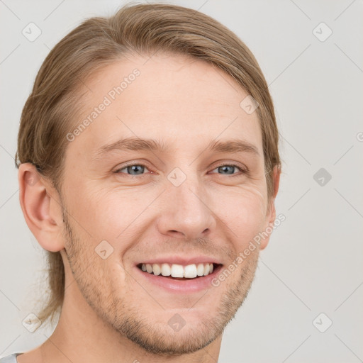 Joyful white adult male with short  brown hair and grey eyes