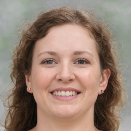 Joyful white young-adult female with medium  brown hair and blue eyes