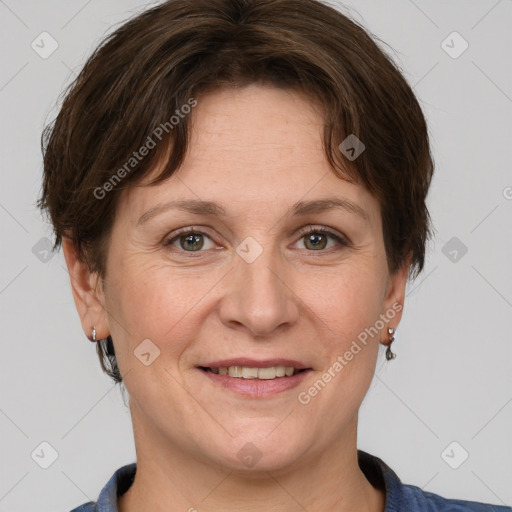 Joyful white adult female with short  brown hair and grey eyes