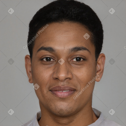 Joyful black young-adult male with short  black hair and brown eyes