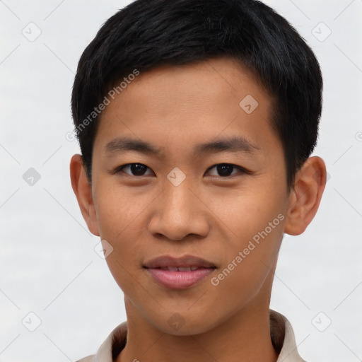 Joyful asian young-adult male with short  black hair and brown eyes