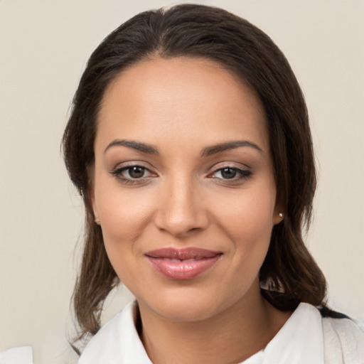 Joyful white young-adult female with medium  brown hair and brown eyes