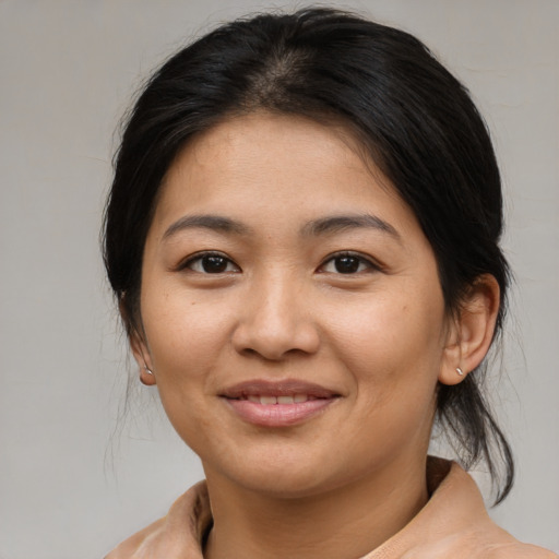 Joyful asian young-adult female with medium  brown hair and brown eyes