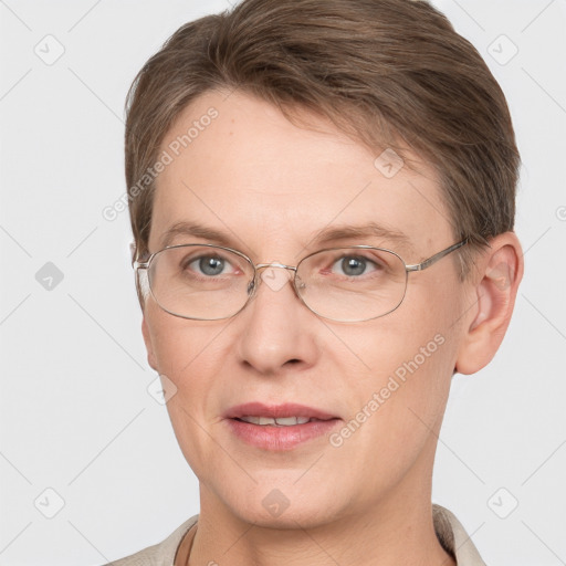 Joyful white adult female with short  brown hair and grey eyes