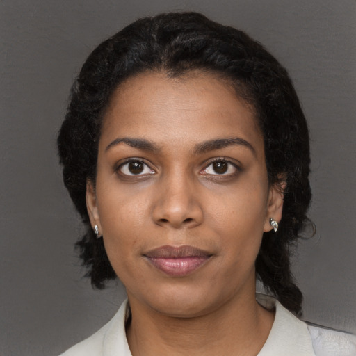 Neutral black young-adult female with long  black hair and brown eyes