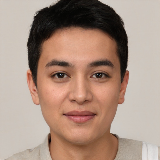 Joyful asian young-adult male with short  black hair and brown eyes