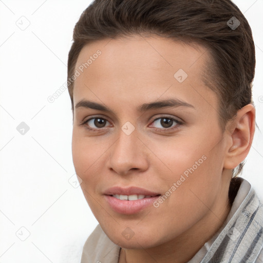 Joyful white young-adult female with short  brown hair and brown eyes