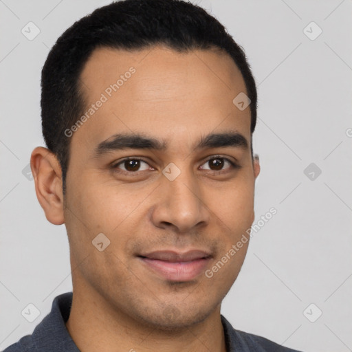 Joyful latino young-adult male with short  black hair and brown eyes