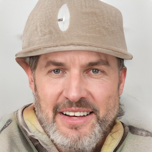 Joyful white adult male with short  brown hair and grey eyes