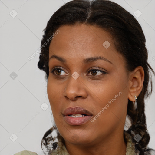 Joyful black young-adult female with medium  brown hair and brown eyes